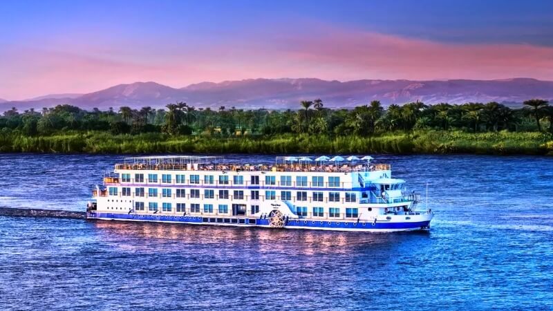 Nile River cruise boat with scenic views in Egypt.