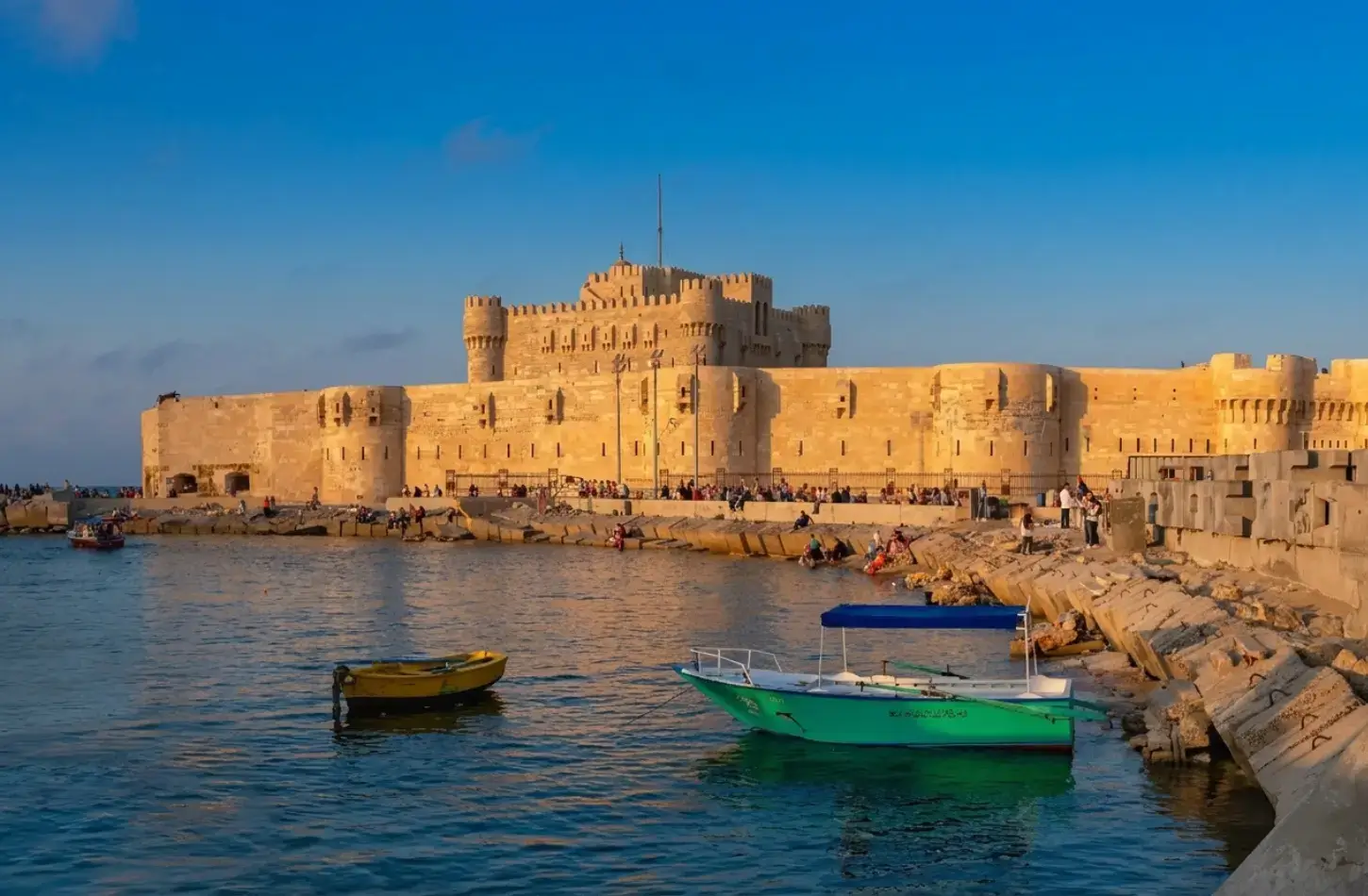 The Citadel of Qaitbay overlooking small boats on the Mediterranean coast during a 7 day Egypt itinerary